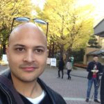 Martin with the changing colors of the Ginkgo trees in Aoyama, Tokyo in the background