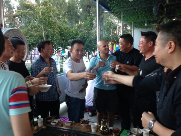 Moonshine toasting with my hosts in China on my month long trip this summer